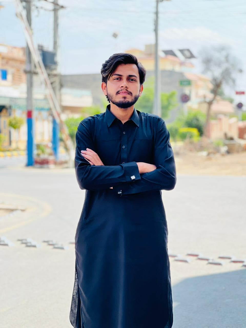 A professional headshot of Zain Ali.